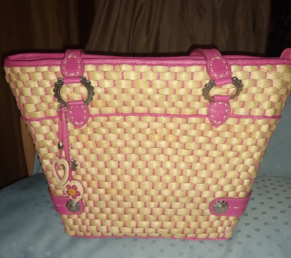 Brighton straw bag with pink trim and handals.